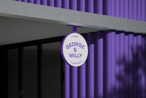 Circular outdoor signage mockup on a purple corrugated wall facade for brand presentation and graphic display.