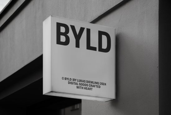 Monochrome storefront sign mockup with bold sans-serif font, ideal for branding and logo design presentation, by Lukas Diemling.