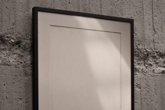 Blank poster frame mockup on concrete wall, modern display, gallery template, editable PSD design for artists and designers.