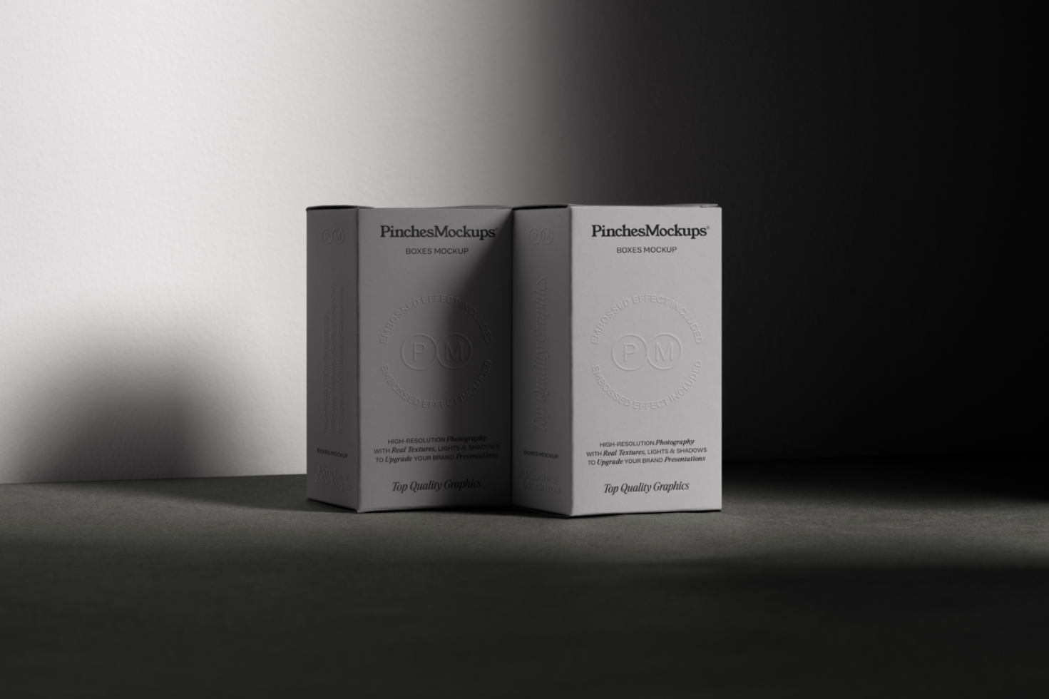 Elegant product packaging mockup with two boxes, realistic shadows, and embossed logo effect perfect for designers to showcase branding projects.