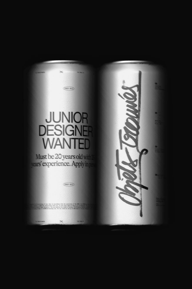 Black and white mockup of two cans with typography design, featuring job ad and graffiti-style font, ideal for presentations and portfolios.