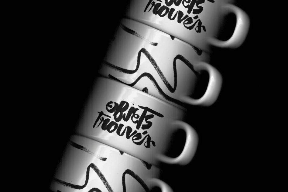 Monochrome stacked mugs with wavy band design, ceramic drinkware mockup