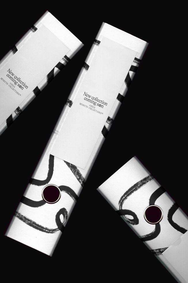 Three cosmetic tube mockups with abstract black and white art design, angled view on dark background for template display.