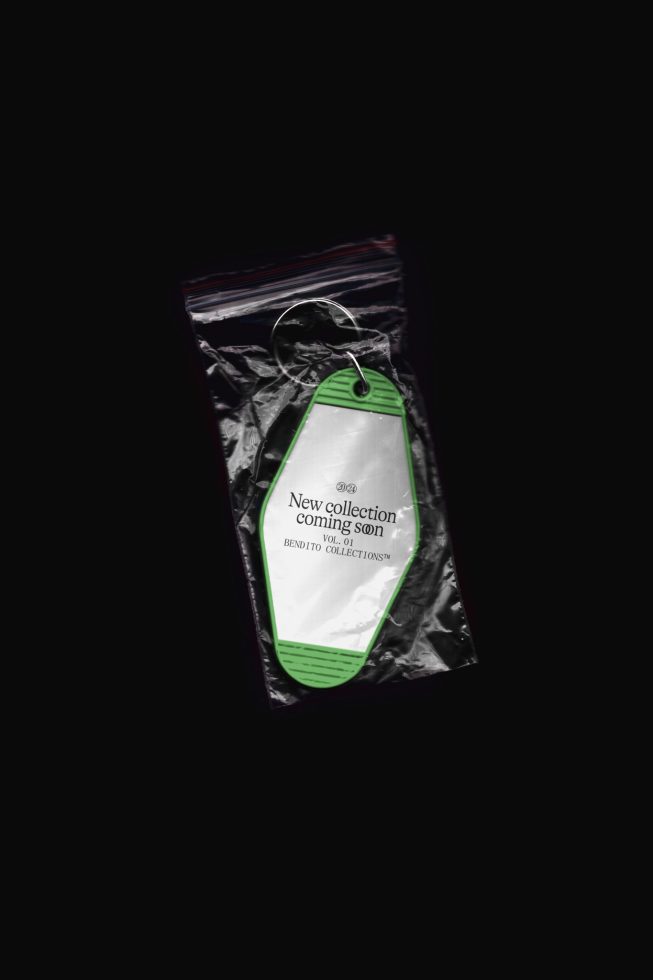 Mockup of clothing label tag on plastic packaging, isolated on black, showcasing design space for branding and product marketing.