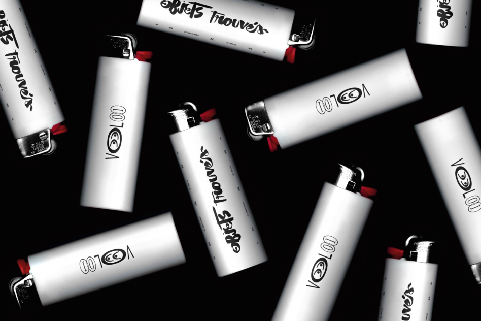 Graphic mockup of branded lighters scattered on dark background, ideal for showcasing logo designs or patterns in a realistic setting.