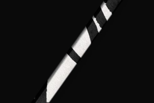 High contrast diagonal striped pattern, abstract background, black and white tones, ideal for graphic design elements.