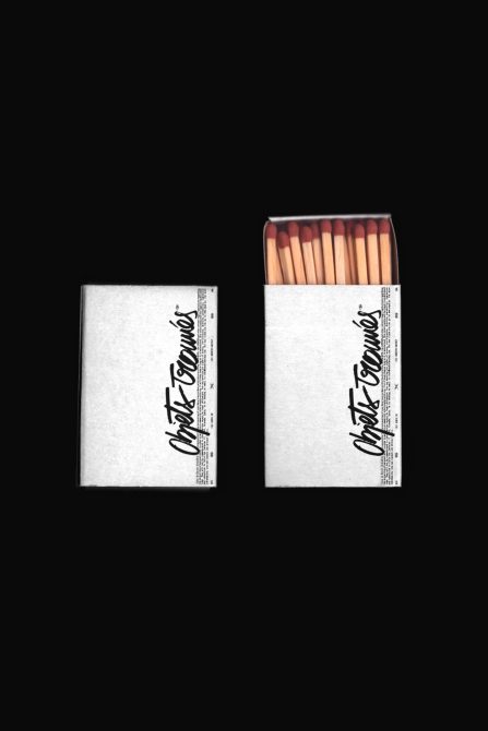 Realistic matchbox mockup with two views, one open with matches, one closed, on a dark background, for packaging design presentation.