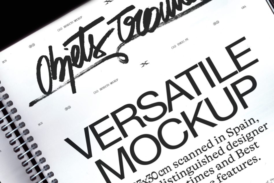 Close-up angled detail of spiral notebook with white pages displaying bold sans-serif text