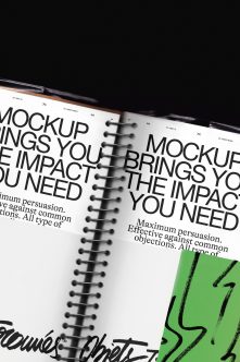 Spiral bound notebook mockup with bold typography on white pages, black pen, bright green accent card