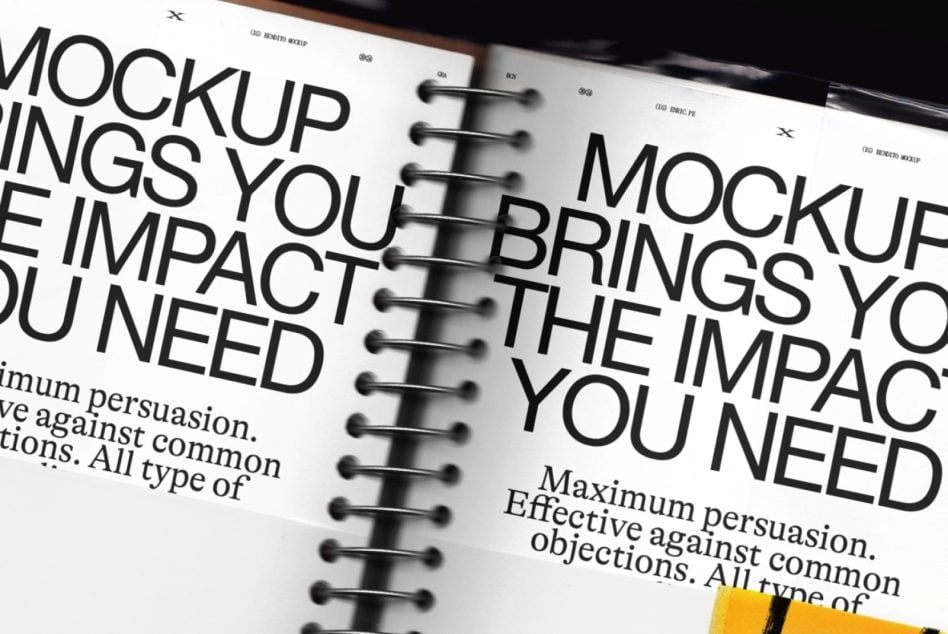 Spiral-bound notebook mockup with bold sans-serif typography on white pages