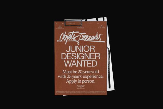 Mockup of a brown paper design job advertisement clip on a black background, highlighting creative fonts and graphics.