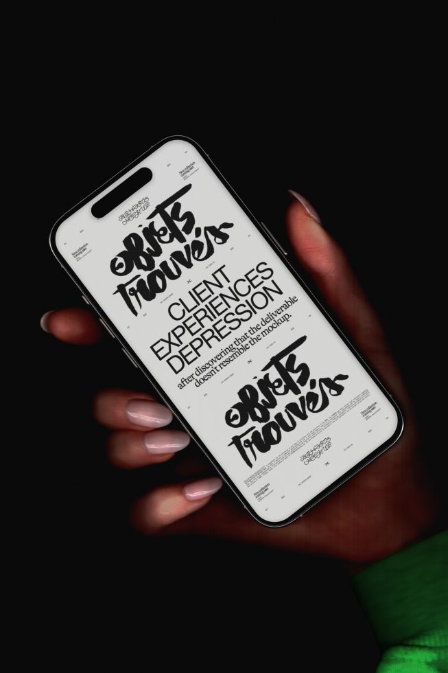 Hand holding smartphone with bold typography mockup design on screen, ideal for presentations, digital artwork showcase, dark background.