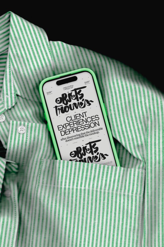 Smartphone with striking graffiti style font on screen overlaid on a green striped shirt, representing mockup for urban fashion branding.