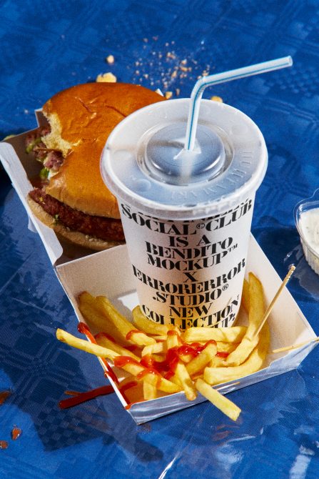 Realistic fast food mockup with burger, fries, and soda on blue textured background, perfect for food-related design projects.