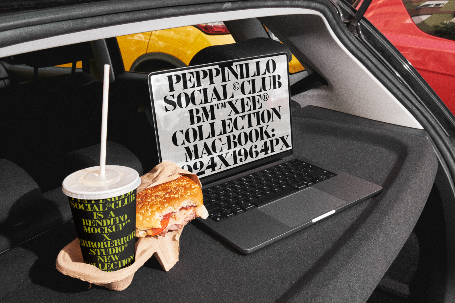 Laptop on car seat with bold typography on screen, soda cup and half-eaten burger, urban mockup scene, design presentation, realistic template.