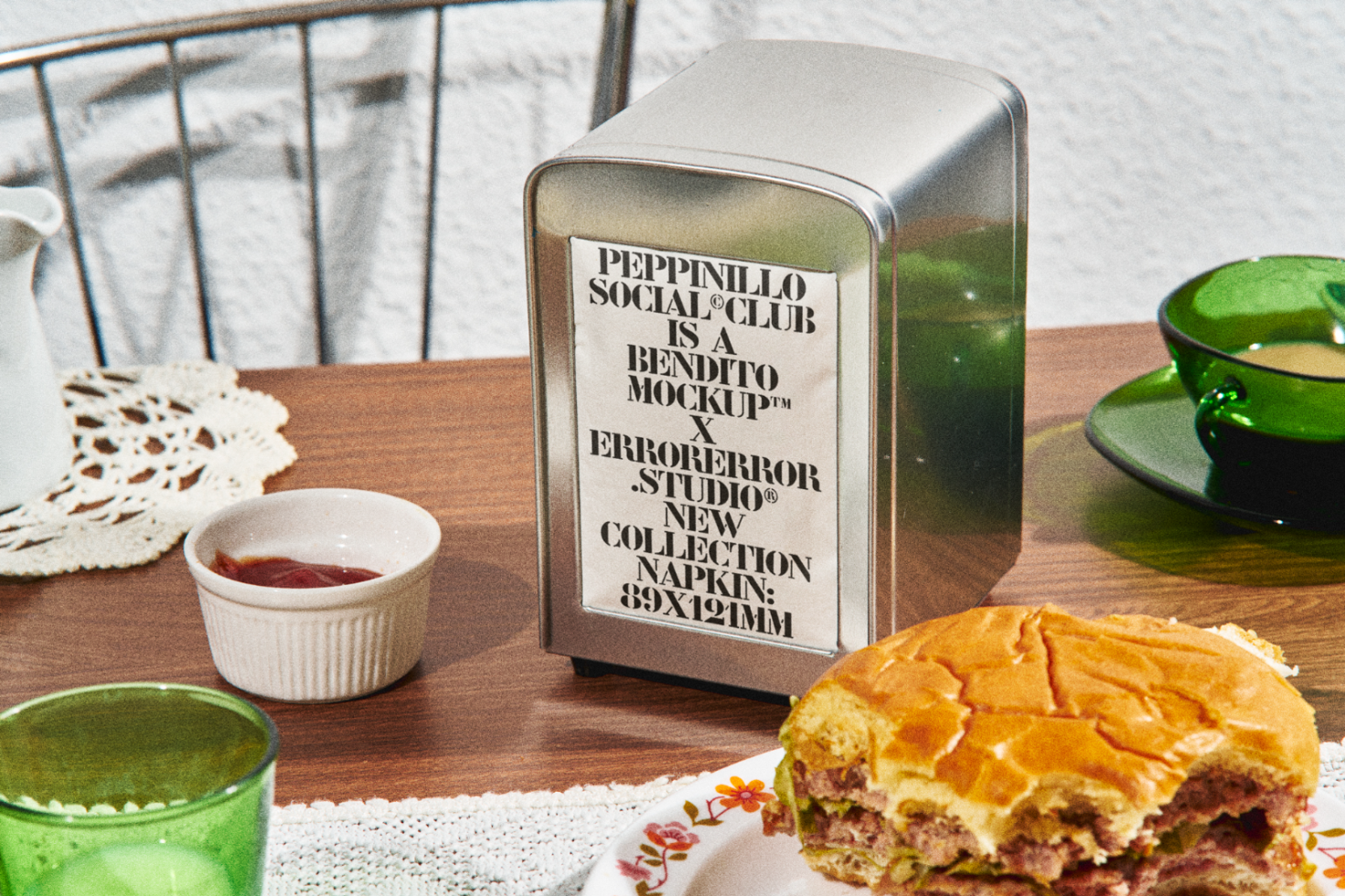 Vintage diner setting with menu napkin dispenser mockup on wooden table, design template for graphics and branding.