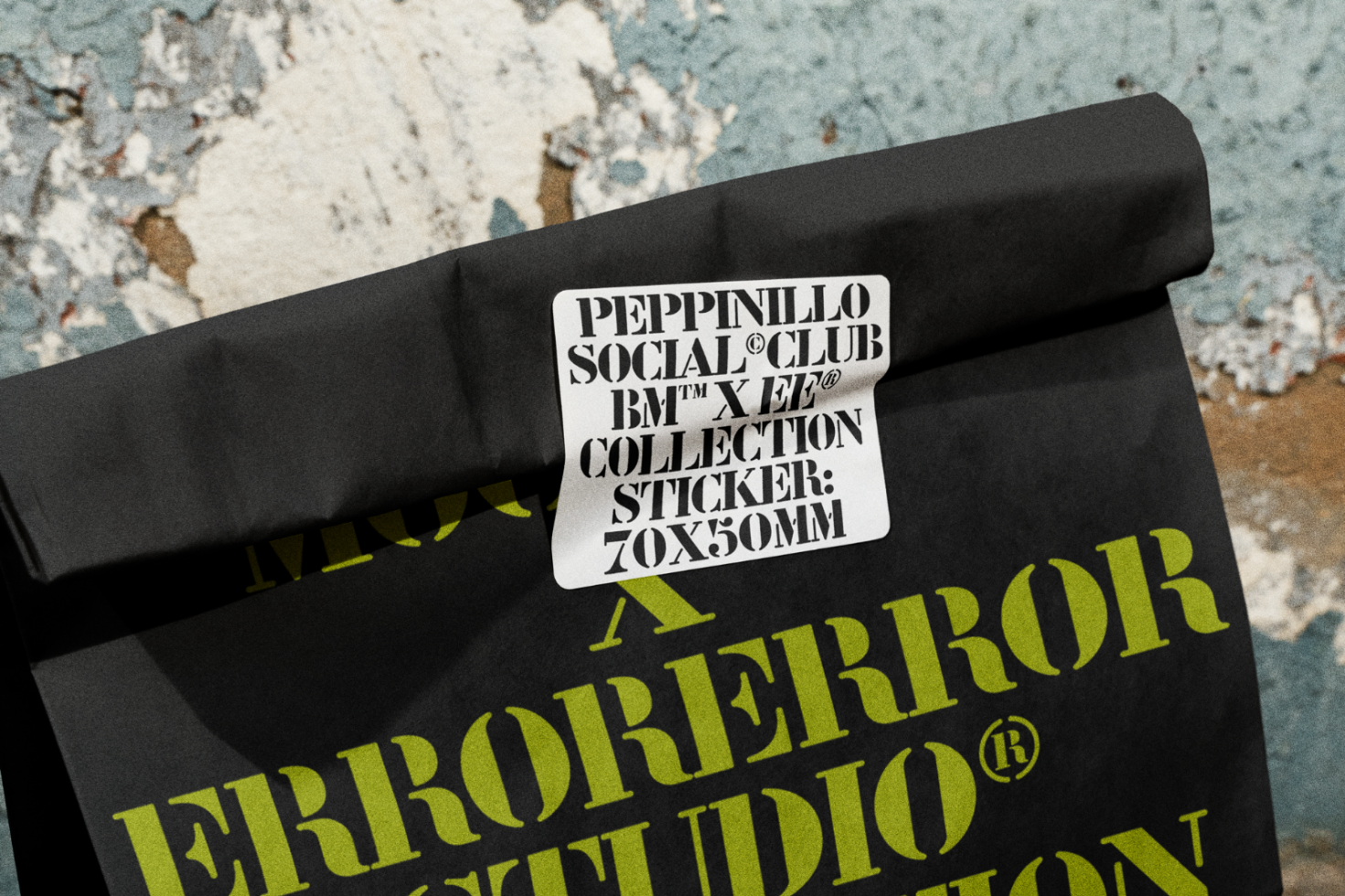 Black fabric mockup with bold typography sticker graphic design, ideal for showcasing branding and apparel projects for designers.