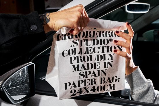 Person holding a typographic paper bag design mockup with bold font, showcasing product packaging, graphic design inspiration for designers.