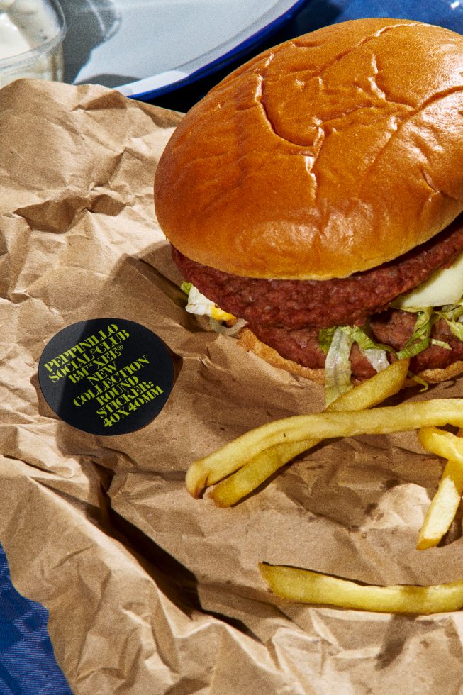 Realistic burger mockup with fries and paper packaging, ideal for restaurant branding design presentations, fast food menu graphics, and culinary templates.