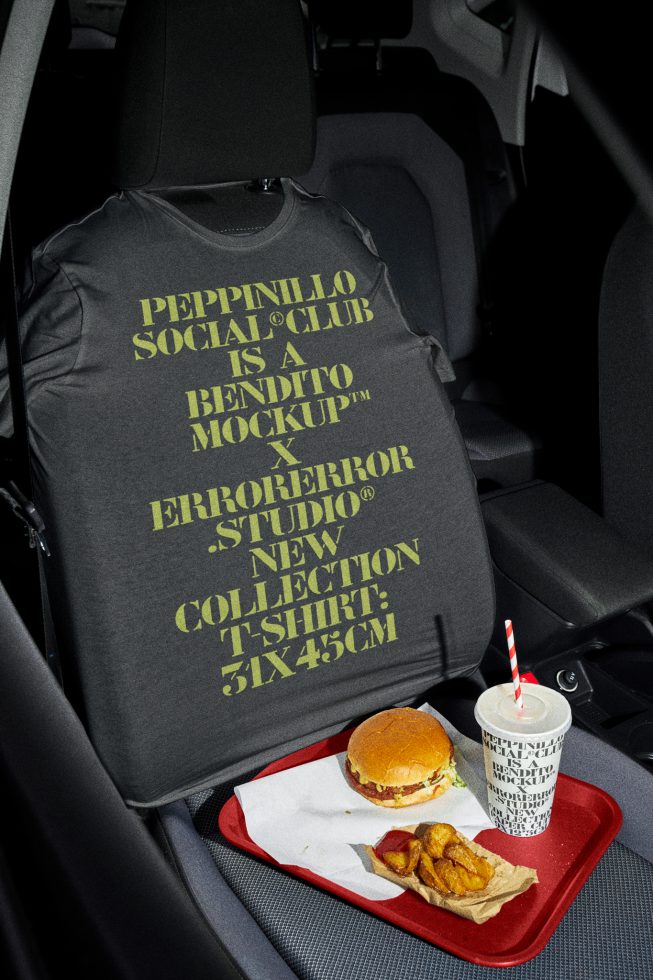 T-shirt mockup on car seat with fast food meal, ideal for presenting apparel designs and graphics in a casual, urban setting for creative designers.