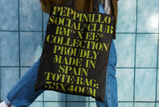 Urban style tote bag mockup with bold typography design on blue tiled background, highlighting fashion, accessories, and streetwear template.