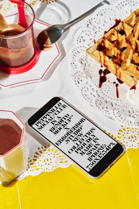 iPhone mockup surrounded by waffles, drinks, doilies on bright yellow background