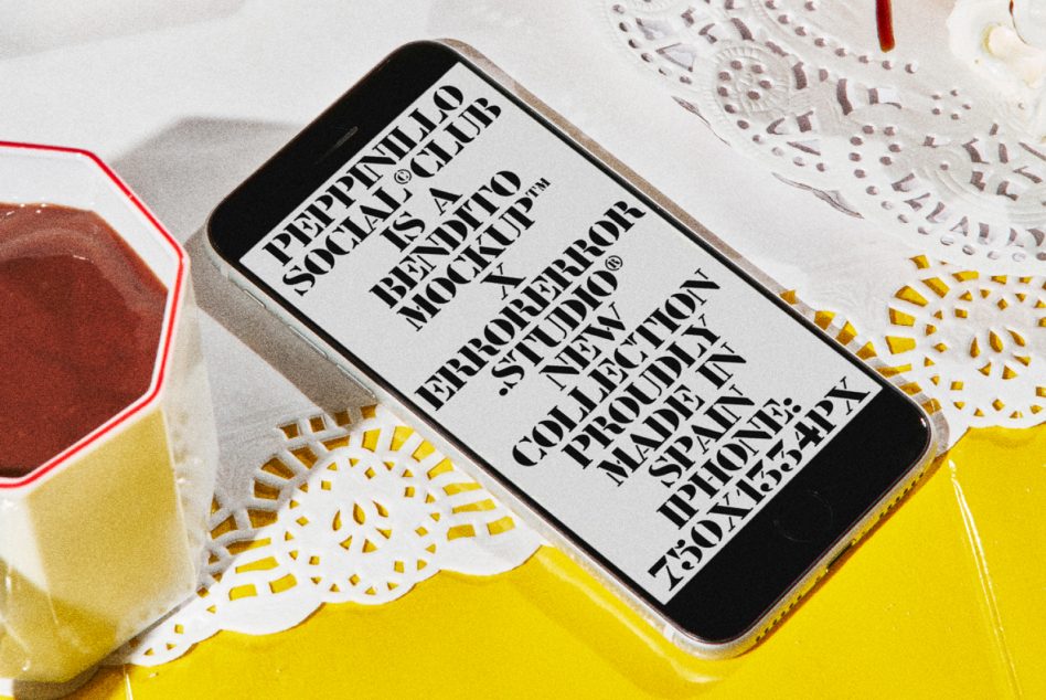 iPhone mockup showing black screen with white serif text on wooden table