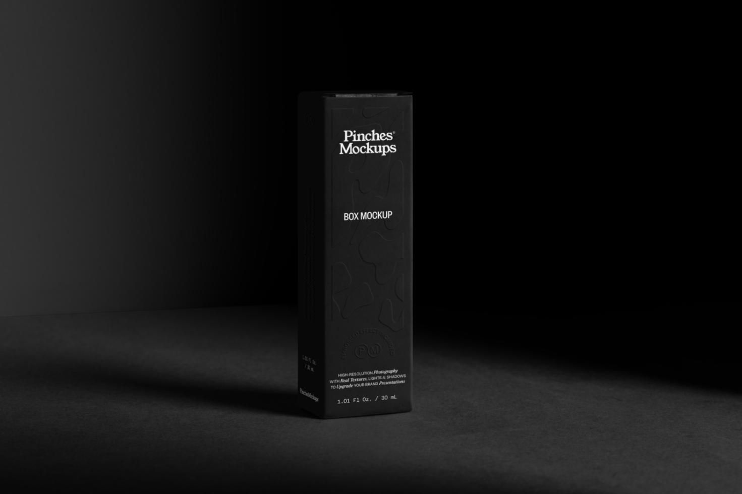 Elegant black box mockup with subtle texture on dark background, ideal for packaging design presentations and branding.