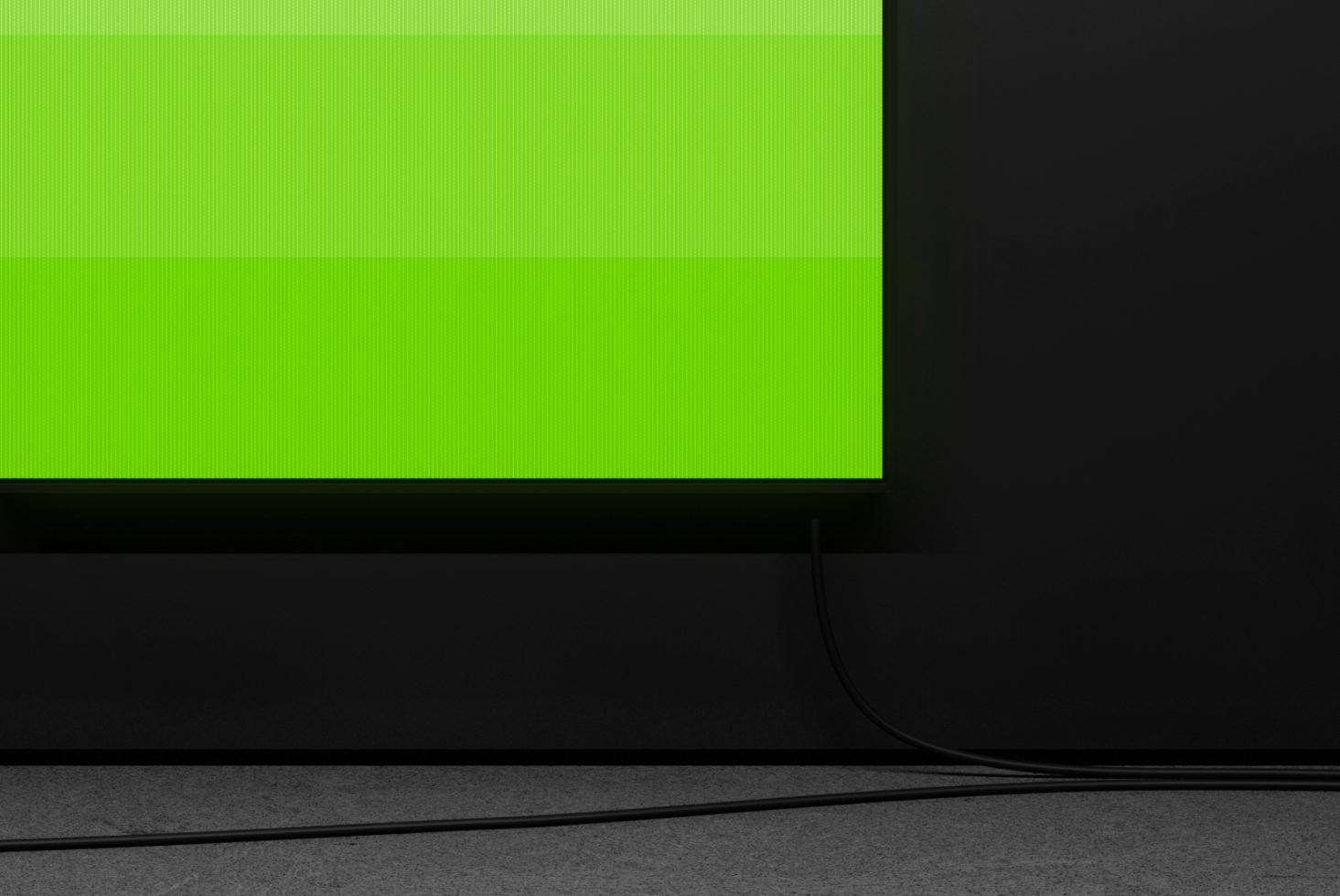 Modern monitor mockup with vibrant green screen on a dark minimalistic desk, ideal for website design presentations and tech displays.