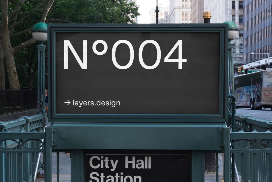Dark framed subway billboard N°004 at City Hall Station with city skyline backdrop