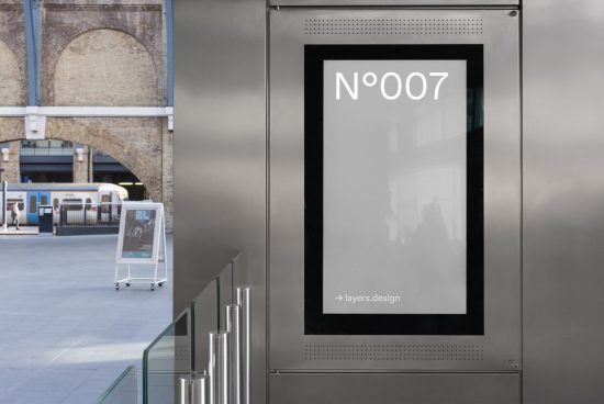 Urban poster mockup displayed in a metallic frame at a train station for designers to showcase advertising designs and fonts in a realistic setting.