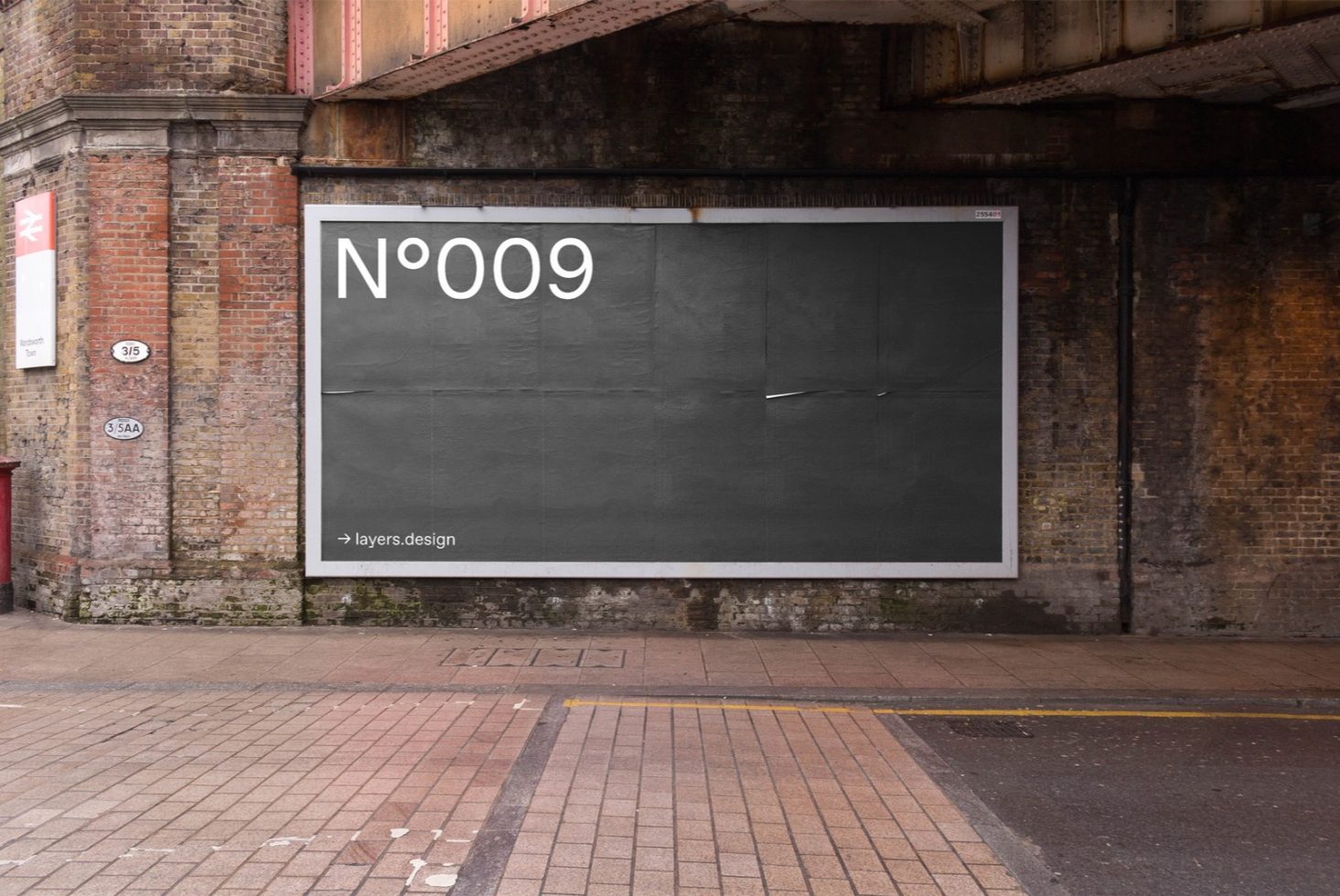 Urban billboard mockup under a bridge on a brick wall background for outdoor advertising design presentation.