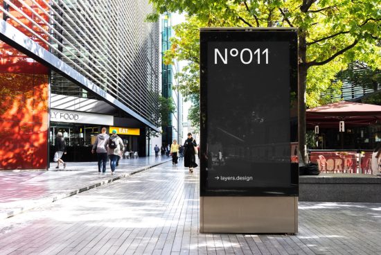Urban billboard mockup in a street setting with pedestrians, for outdoor advertising graphics display. Ideal for designers, mockups category.