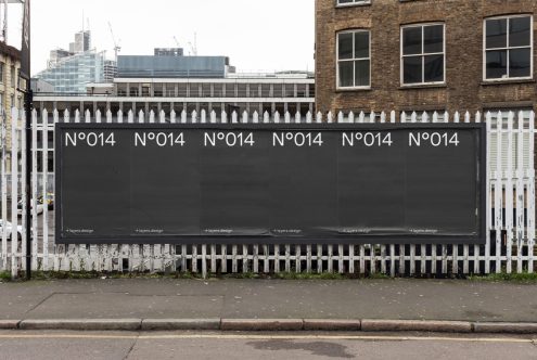 Billboard mockup on urban street with buildings, ideal for outdoor advertising designs, digital asset for graphic designers, realistic cityscape.