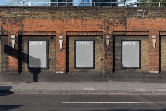 Urban brick wall with three blank billboard mockups for poster design display, clear sky, shadow on pavement, realistic textures for graphic designers.