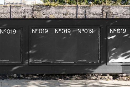 Outdoor poster mockups on a city wall for presenting design work, showcasing fonts or advertising graphics, editable digital asset.