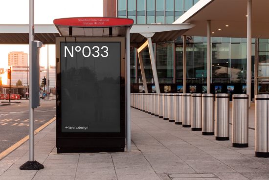 Outdoor advertising mockup at dusk in an urban setting near Stratford International Station, suitable for displaying ad designs and graphics.