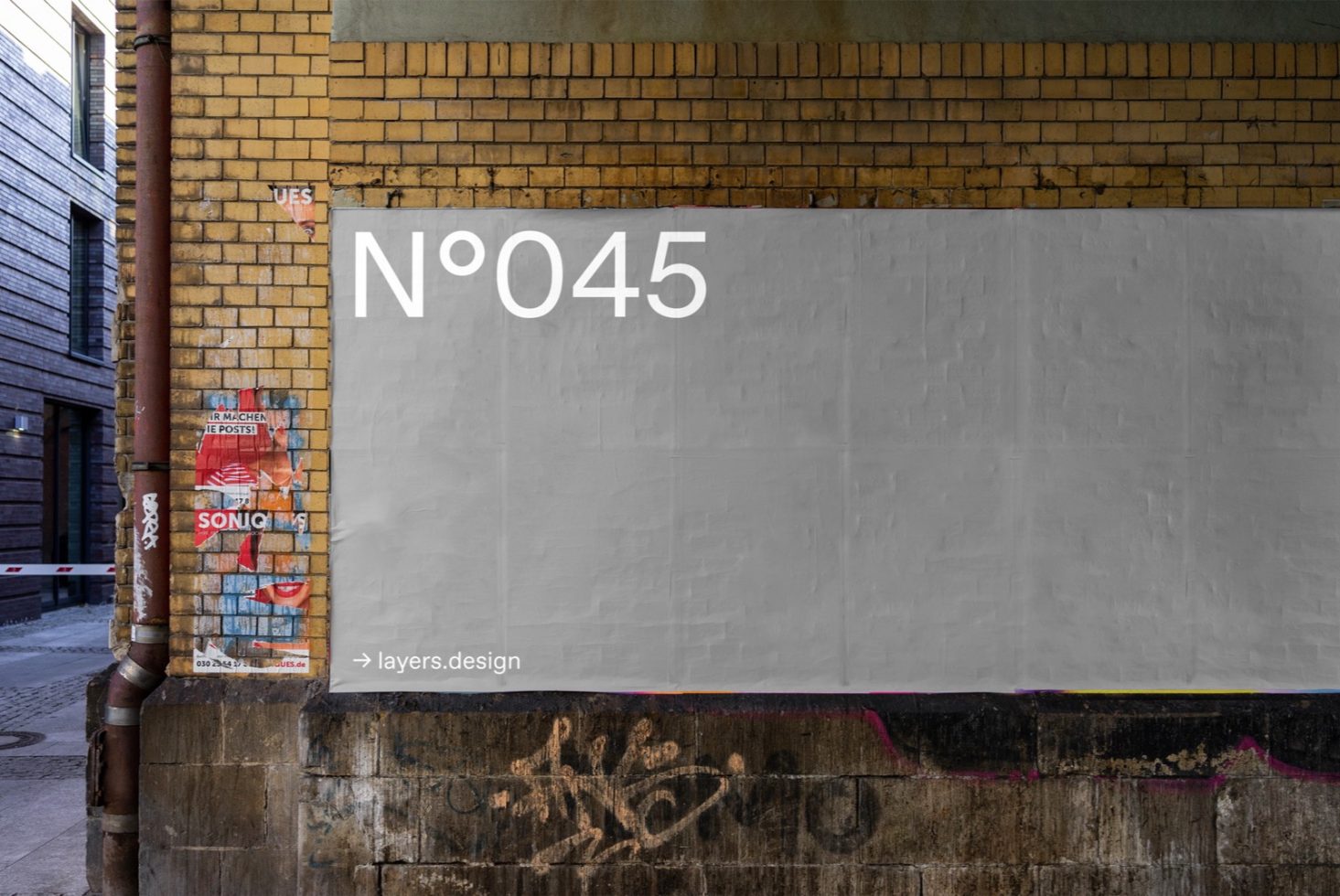 Urban street wall mockup with a blank billboard for design presentation, textured urban background, graffiti, and advertising space.