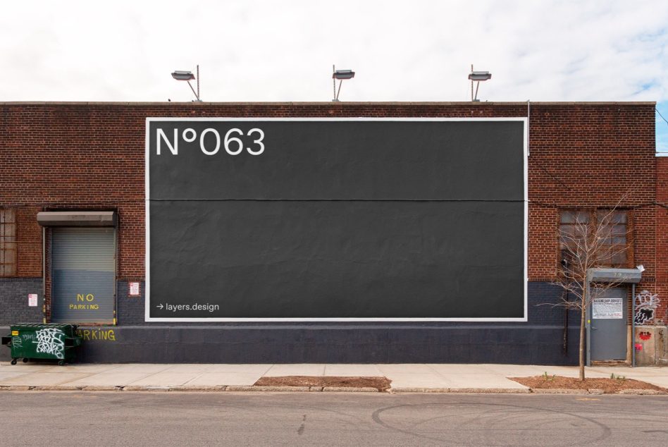 Industrial brick wall billboard mockup with dark lower section for design placement