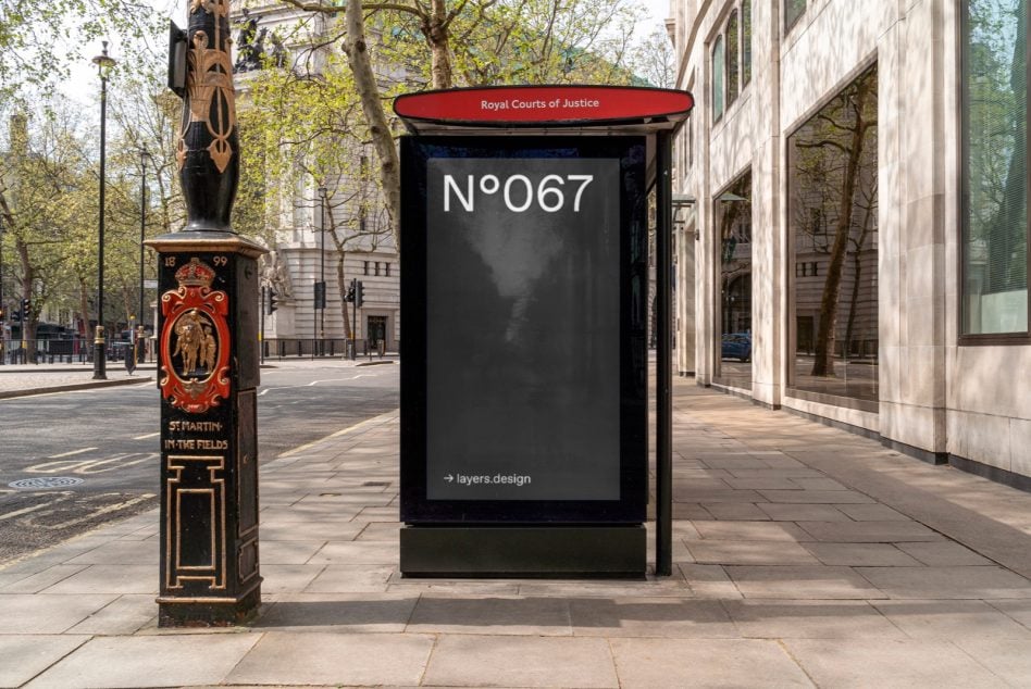 Dark poster displaying N°067 in urban courtyard setting with historic pillar