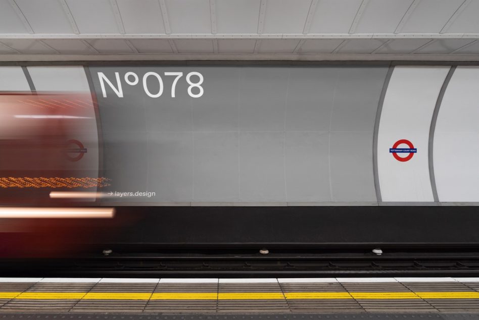 Blurry subway train in motion at a station platform with urban signage, suitable for transportation mockups and urban design templates.