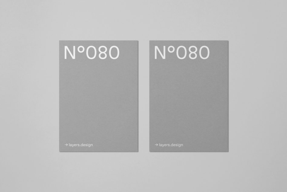 Minimalist magazine mockup with two gray covers featuring elegant typography ideal for presentation template design and branding projects.