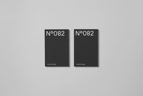 Two minimalistic black book cover mockups with white typography on a gray background, perfect for showcasing publication design.