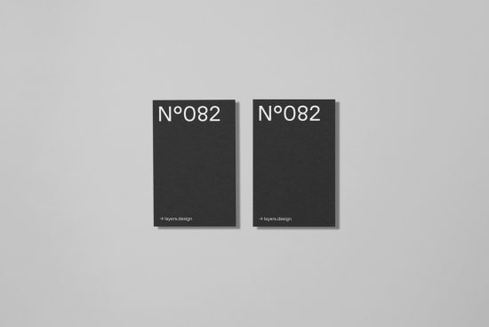 Two minimalistic black book cover mockups with white typography on a gray background, perfect for showcasing publication design.