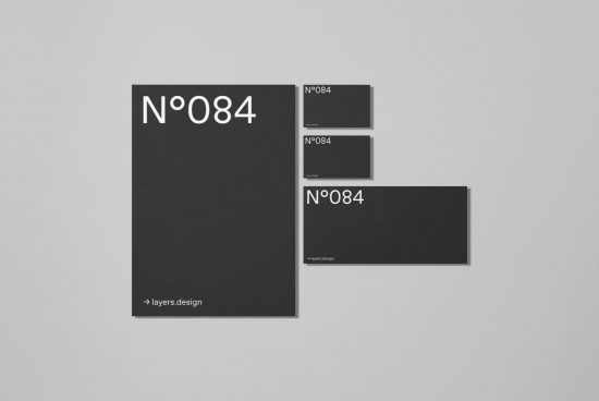 Elegant stationery mockup set with black design elements and minimalist typography for presentation and portfolio showcase.