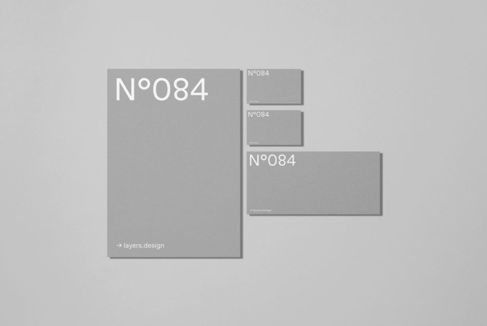 Gray folder mockup with matching business card sizes labeled N°084