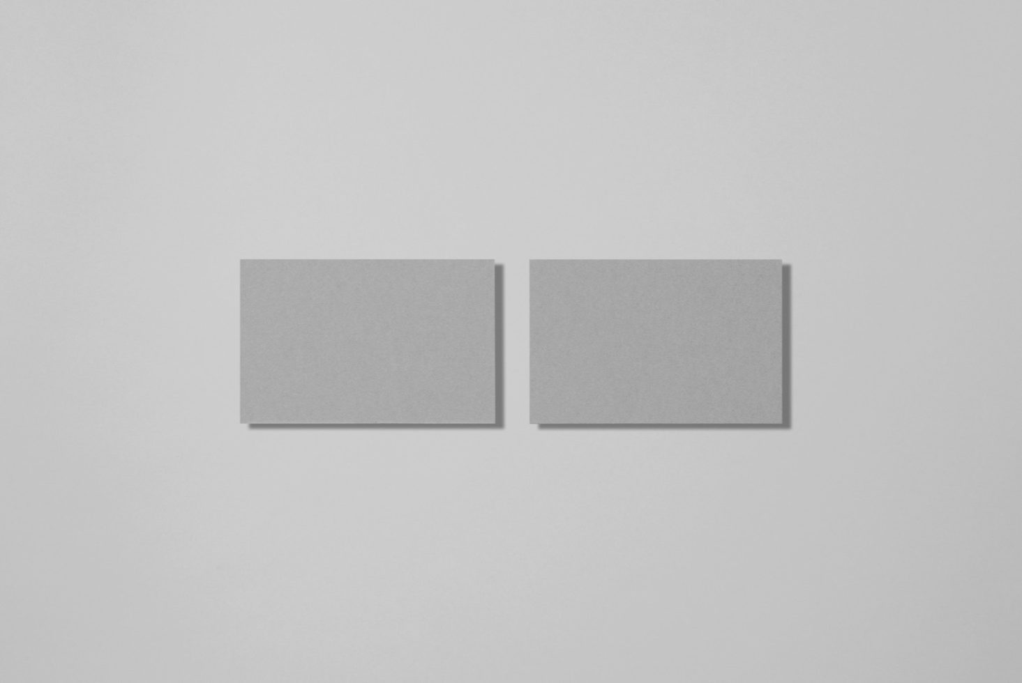 Two grey square mockup cards on a light background, ideal for branding presentation, design showcase, stationery mockups.