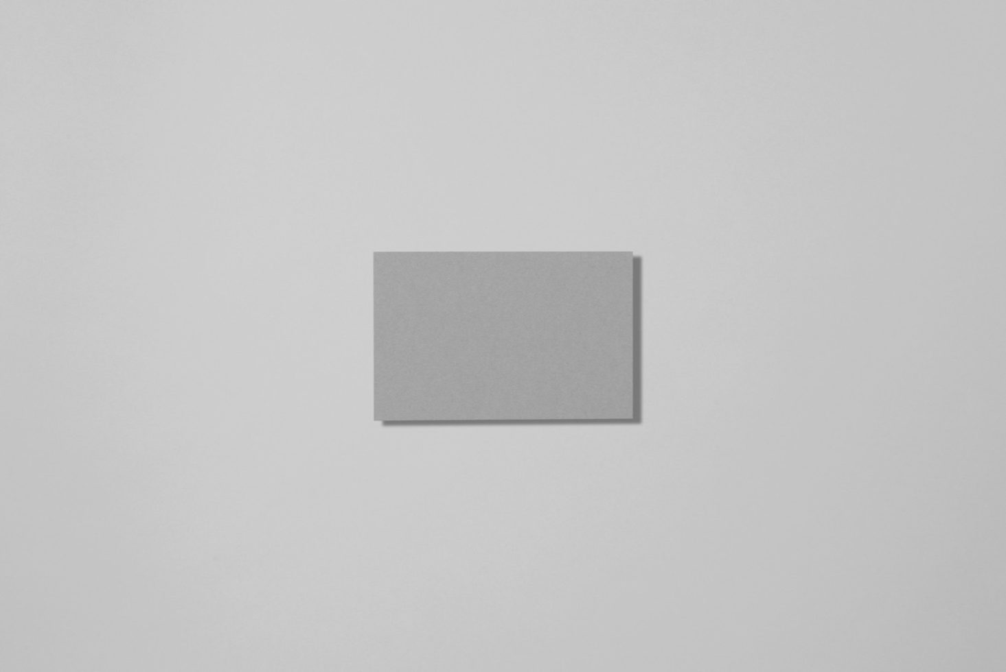 Blank square paper mockup on a clean, light background, ideal for graphic design and branding presentations.