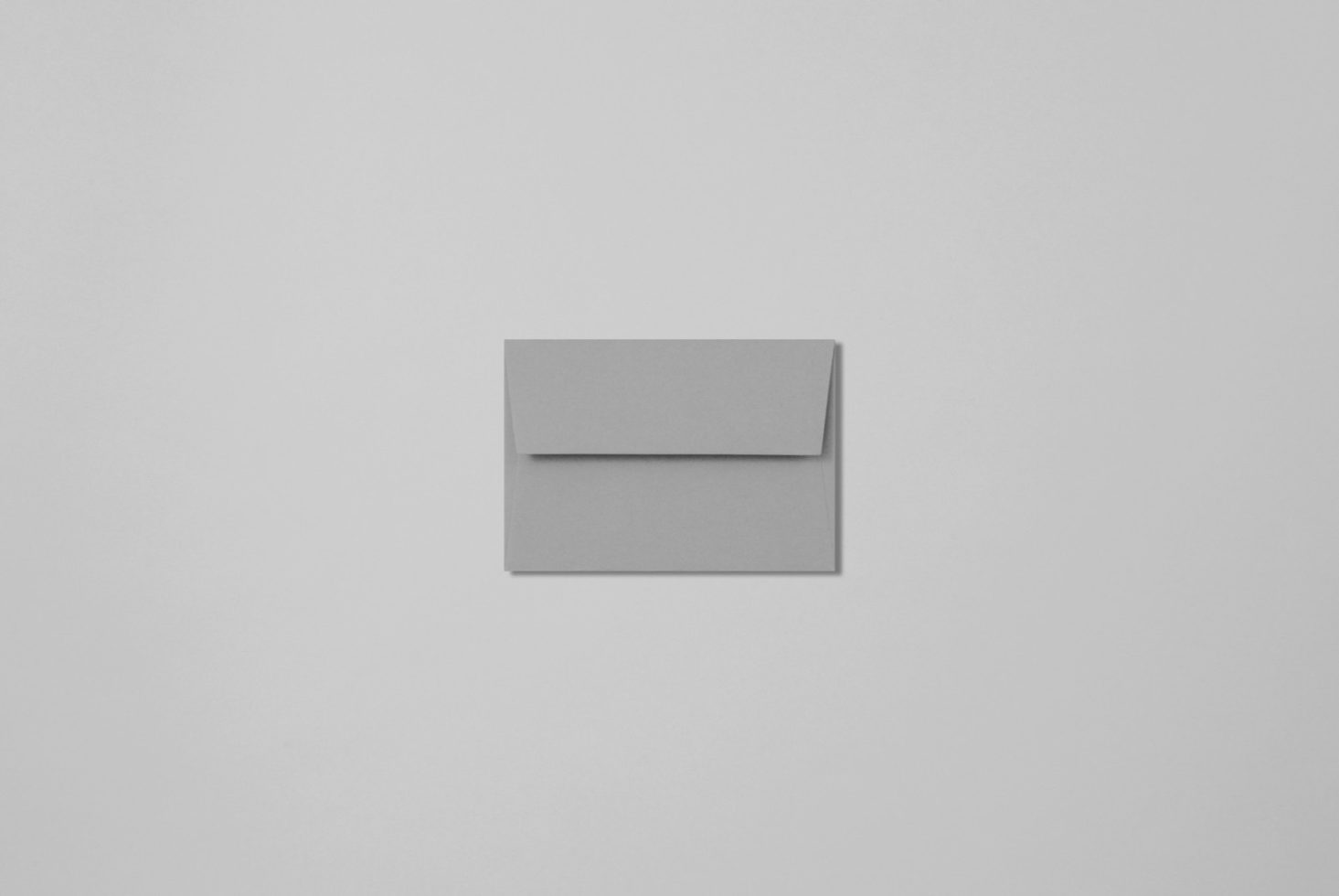 Minimalist envelope mockup top view on a plain background, ideal for sleek design presentations in graphics and templates category.