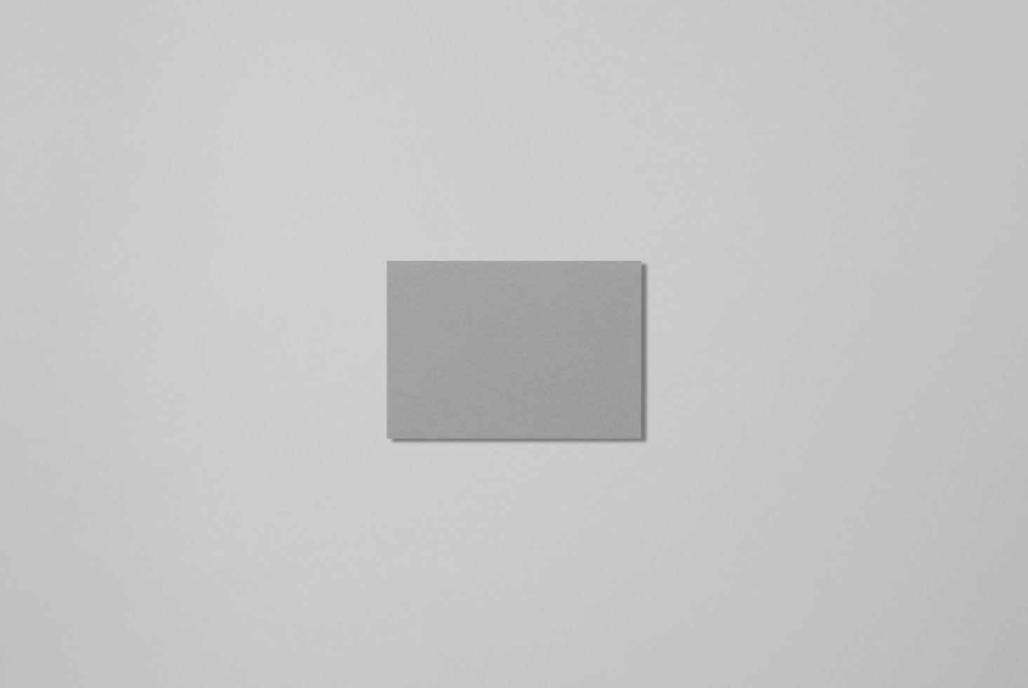 Square blank grey card mockup on a light background, ideal for brand design presentations and graphic display.